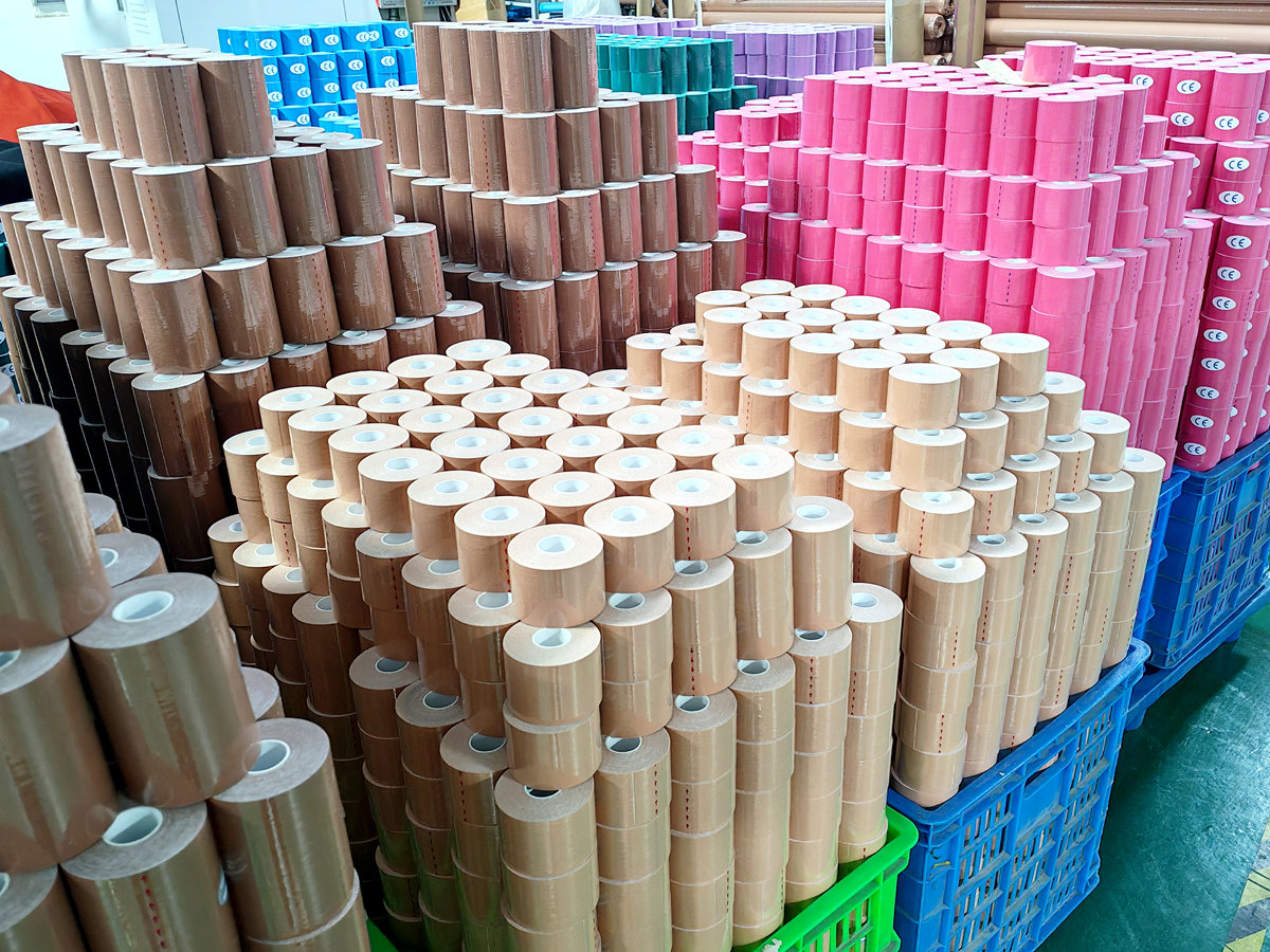 {"default":"Piles of nipple covers and kinesiology tape rolls are stacked in the factory, awaiting packaging"}
