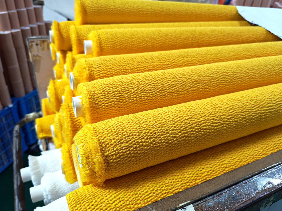 {"default":"Raw cotton and elastic yarn storage area for cohesive bandage production"}
